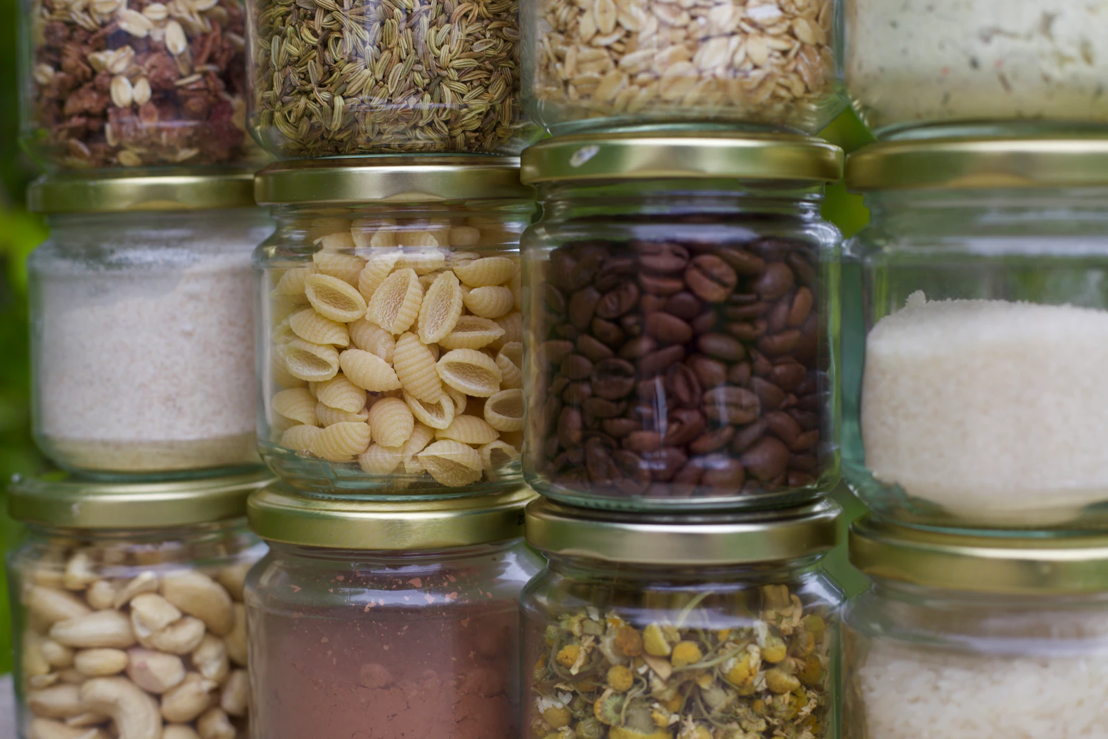 Glass containers filled with dry pantry foods for organized storage
