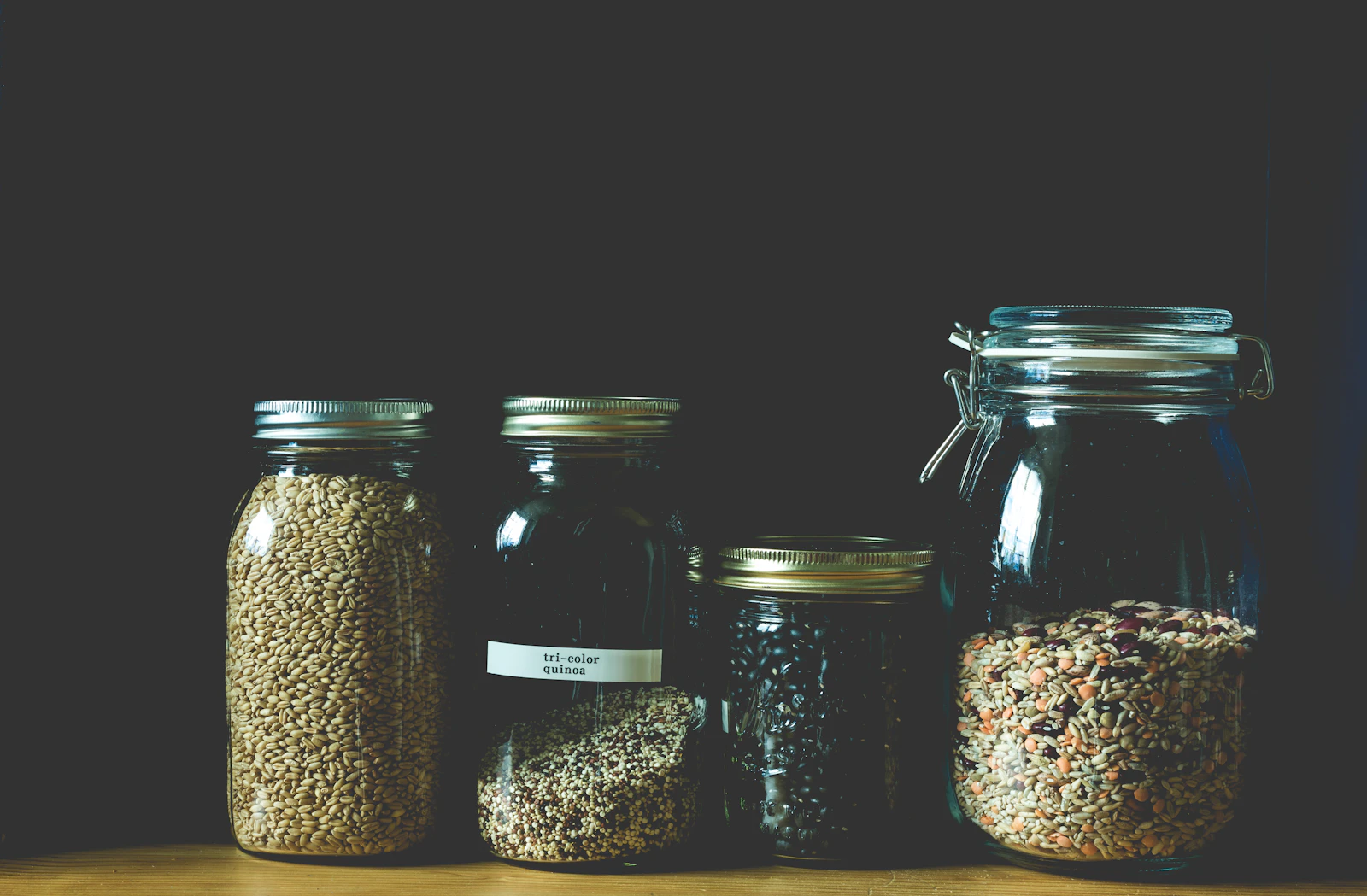 Organized dry pantry ingredients stored in glass jars