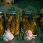 Homemade fermented dill pickles in glass jars
