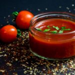 Thick homemade tomato paste prepared for home canning